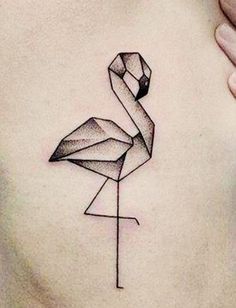 a flamingo tattoo on the back of a woman's stomach, with geometric shapes