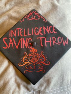 a black graduation cap with red writing on it