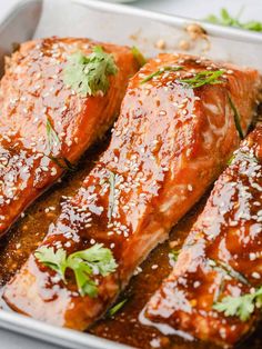 salmon covered in sauce and garnished with parsley