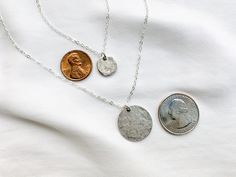 Choice of Small or Large Minimalist Silver Hammered Coin Medallion Necklace Silver Coin Necklaces are classic and timeless. These pieces are no exception. Select your choice of Large or Small (or both) Coin Necklace(s) at checkout- *Sold individually, but shown pictured together for displaying style options. Features a .999 Fine Silver over Pewter Disc Coin that has been hammered for that highly sought after rustic look of an ancient coin. Both sides are textured the same, so this is very easy t Silver Layering Necklaces, Necklaces Simple, Silver Coin Necklace, Silver Link Chain, Floating Necklace, Ancient Coin, Layered Necklaces Silver, Raw Crystal Necklace, Best Friend Necklaces