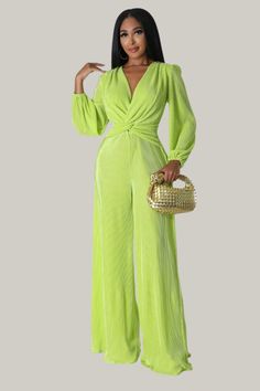 Turn heads with our Nancy Plunging Neck Lantern Sleeve Wide Leg Jumpsuit. Featuring a deep V-neck and twist detail, this jumpsuit is designed with long bishop sleeves and a high waist for a flattering fit. The wide-leg, loose fit, and long length provide a chic, comfortable look, while the medium stretch fabric ensures ease of movement. Complete with a zipper closure, this jumpsuit is perfect for making a bold fashion statement at any event. 95% Polyester, 5% Elastane Model is wearing size small