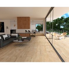 a living room filled with furniture next to a large glass wall covered in wood planks