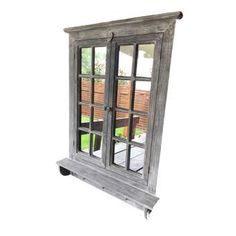 an old wooden window with glass panes on the outside and inside, is shown against a white background