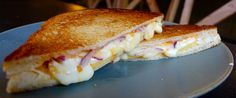 a grilled cheese sandwich with red onions and mayonnaise on toasted bread