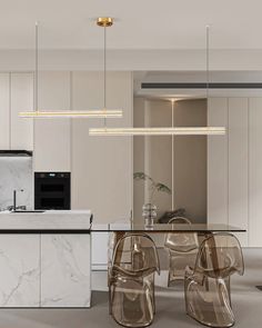 a modern kitchen with marble counter tops and white cabinets