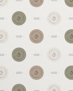 several circular logos on a white wallpaper with brown and gray circles in the middle