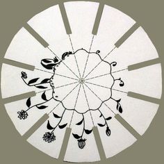 a circular drawing with flowers and birds on it's center piece, in black and white