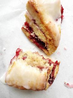 two pastries sitting on top of white paper