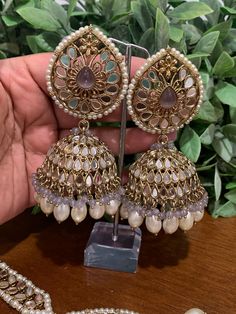 Top class mirror work. Brass base , antique platting , silver mirror and colored bead work. Jhumka is about 5 inch long and Tikka is 3 inch long and 2.75 inch wide. Mirror Jhumka Earrings, Temple Jewelry Chandbali Jhumkas For Festival, Silver Cutdana Danglers For Party, Elegant Heavy Jhumkas For Festival, Elegant Festival Jhumkas, Silver Danglers With Cutdana For Party, Silver Party Danglers With Cutdana, Silver Kundan Bollywood Jhumkas, Metal Temple Jewelry Jhumkas For Festivals