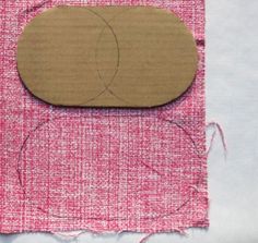 a piece of fabric with a wooden object on it