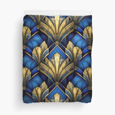 blue and gold art deco style duvet cover with an abstract design on the front