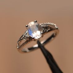 It is natural moonstone ring, the main stone is about 6mm*8mm, oval cut, The basic metal is sterling silver and plated with rhodium. To change the metal to a solid gold (white/rose) or platinum is also available, please ask for a quotation if you want. You can also go to my shop Home for more elegant rings: https://www.etsy.com/shop/godjewelry?ref=hdr_shop_menu More alexandrite rings: https://www.etsy.com/shop/godjewelry?ref=seller-platform-mcnav&search_query=moonstone Customization is alway Moonstone Engagement Ring Silver, Alexandrite Rings, Elegant Rings, Pretty Engagement Rings, Edgy Jewelry, Cute Engagement Rings, Future Engagement Rings, Moonstone Ring Sterling Silver, Alexandrite Ring