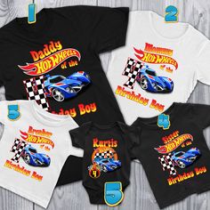 three baby onesuits with racing cars on them