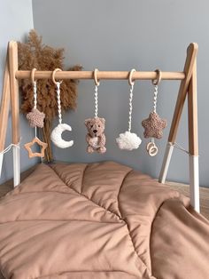 there is a teddy bear hanging on the bed