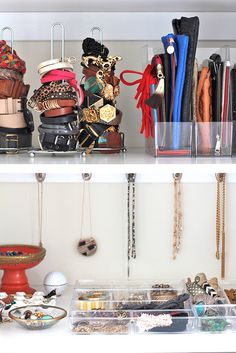 there are many necklaces on the shelves