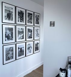 black and white photographs are hanging on the wall