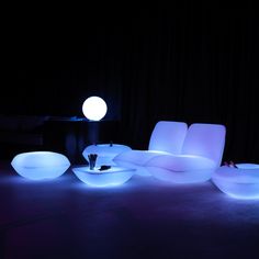 the modern furniture is lit up with white lights