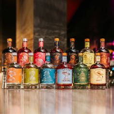 bottles of alcohol lined up on a table