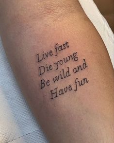 a tattoo saying live fast die young be wild and have fun