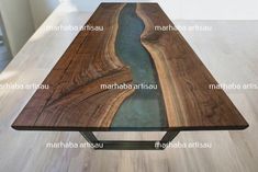 the table is made out of wood and has a river running through it with metal legs