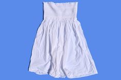 white baby doll tube top with a smocked top half. by J.Crew. 100% Cotton. Size SMALL. 25.5 inches chest/bust, 26.25 inches length. White Ruffled Strapless Tube Top, White Strapless Ruffled Tube Top, White Strapless Tube Top With Ruffles, Spring Cotton Tube Top With Smocked Back, White Smocked Bodice Tube Top, Cotton Tube Top With Smocked Bodice, White Casual Tube Top With Smocked Bodice, Casual White Tube Top With Smocked Bodice, Summer Cotton Tube Top With Smocked Bodice