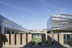 the building is made out of concrete blocks and has a large metal structure on it's side