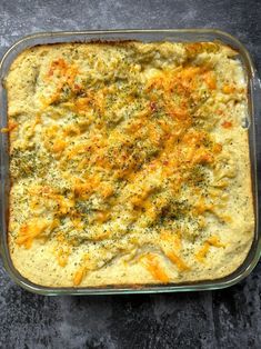 a casserole dish with cheese and broccoli in it