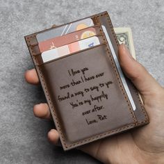 "Personalized with a handwritten message of your choice, this wallet will be a perfect sentimental gift for your loved one. The handwritten message engraved on the back could be up to 28 words and you can choose the style for the front engraving. **By default, the front of the wallet is the side without card slots, and the back is the side with card slots. P R O D U C T ∙ I N F O * Material: Genuine cowhide leather * Dimensions: 3 1/6\" x 4 3/8\" (8x11 cm) * Features: - 3 card slots - 1 hidden s Father's Day Gift Card Holder With Slots, Valentine's Day Gift Wallet With Card Slots, Valentine's Day Gift Wallets With Card Slots, Valentine's Day Wallet Gift With Card Slots, Valentine's Day Wallets With Card Slots, Customizable Leather Wallets For Gifts, Customizable Leather Wallets As Gifts, Bifold Card Holder With Card Slots As Gift, Personalized Bifold Card Holder With Card Slots