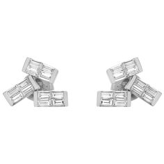 These delicate and feminine diamond stud earrings are lightweight and make a highly impactful statement. Features channel set baguette cut diamonds weighing 0.90 carat. Diamond Quality: G-H color and VS-SI. Secured with easy pushbacks. Crafted in fine 18k white gold. Total earring weight: 2.41 grams. Comes with a presentable gift box. Luxury White Baguette Cut Earrings, Baguette Cut Diamond, Diamond Stud Earrings, Channel Set, Diamond Stud, Baguette Cut, Diamond Earrings Studs, Diamond Studs, Jewelry Earrings Studs