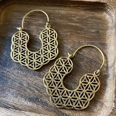 Flower of Life earrings, Mandala earrings, Sacred geometry. Material: High quality brass. Diameter: W - 1.5 inches  L - 1 3/4 inches. ~ Flower Of Life ~ The flower of life symbol,  mystical and ancient holds the secrets of the universe and its creation.  This symbol is said to hold the most important and most sacred patterns of the universe and is the harbinger of all life and existence--from molecules and atoms to planets and galaxies  ** Caring for Brass jewelry ** - Using a toothbrush and too Sacred Patterns, Boho Spiritual, Flower Of Life Pattern, Flower Of Life Symbol, Mexican Fire Opal Ring, Mandala Earrings, Divine Beauty, Brass Hoop Earrings, Seed Of Life