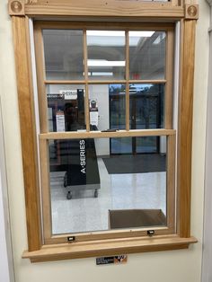 an empty room with a large window and some signs on the windows sills