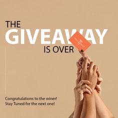 the giveaway is over with two hands reaching up for an orange card that reads, congratulations to the winner stay tuned for the next one