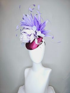 From the 2024 Featured Milliner of the Kentucky Derby Museum  Gorgeous Kentucky Derby hat fascinator  kentucky derby hat fascinator purple magenta satin with lavender flower with purple feathers beaded flower decor headband attachment.  each hat is totally one of a kind! no two are alike! * I can add feathers or flowers to any existing hat to help customize your look for a small fee. Message me for requests, I am happy to help!  *All hats are sold as displayed. No returns do to nature of product Luxury Purple Mini Hats For Races, Purple Feather Headpieces For Spring, Purple Mini Hats With Feathers For Kentucky Derby, Purple Feathered Mini Hats For Kentucky Derby, Summer Purple Feathered Fascinator, Elegant Purple Feathered Headpiece, Purple Summer Headpieces For Races, Purple Mardi Gras Party Costume Hats And Headpieces, Purple Mardi Gras Party Costume Hat