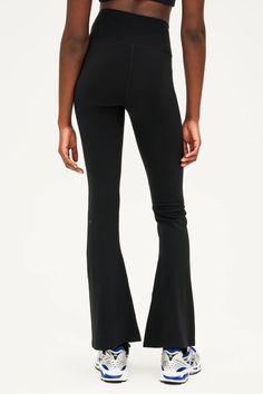 High waisted for flattering shaping Below ankle length tight with flared leg Form fitting, true to size Smooth, chafe-free flatlock seams Reflective 59 logo Imported Sleek High Stretch Bottoms For Pilates, Sleek Stretch Pants For Yoga, Sleek Stretch Workout Pants, Fitted High-cut Elastane Yoga Pants, Fitted High-cut Leg Yoga Pants, Compressive Mid-rise Elastane Bottoms, Sleek Fitted Workout Bottoms, Sleek Fitted Workout Pants, Sleek Fitted Full Length Activewear