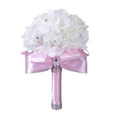 a bridal bouquet with white flowers and pink ribbon on a white background, the bride's bouquet is adorned with swaroes