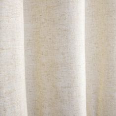 a close up view of a curtain with white linen on the bottom and beige fabric at the top