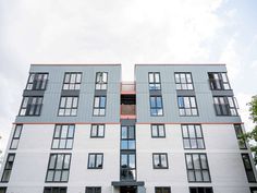 an apartment building with many windows and balconies