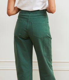 Inspired by the classic painters pants, we fine tuned the Agnes Pants to give that relaxed utilitarian vibe with a fit for curves. Made from thick stretch canvas and featuring a zip fly, and front, back and utility pocket. These are a thicker fabric than our regular pants, but they do have some stretch in them as well. Stretch Canvas. 98% Cotton, 2% Spandex. Machine washable. Made in New York City. Rise - 13" XXS - Waist= 24", Hips= 36", Inseam= 29.25" XS - Waist= 26", Hips= 38", Inseam= 29.5" S Utility Cropped Leg Bottoms With Patch Pockets, Utility Bottoms With Patch Pockets And Cropped Leg, Utility Style Cropped Leg Pants With Pockets, Utility Cropped Leg Pants With Pockets, Fall Cargo Cropped Pants, Fall Cargo Style Cropped Pants, Fall Cropped Cargo Pants, Green Utility Parachute Pants For Work, Green Wide Leg Cargo Pants With Five Pockets