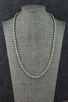 This sterling silver Navajo pearl necklace was made by Navajo silversmith Dorinda Mariano.Necklace: 20"Bead size: 3/16" x 3/16" (5mm x 5mm)Free shipping on all orders! We ship with USPS and always include tracking. All orders ship within a day of payment.Returns are accepted up to 30 days after you receive your order. Just send us a message. Our shop offers cash back or store credit. The item must be returned in new condition. Southwestern Silver Beaded Necklace With Sterling Clasp, Southwestern Style Silver Single Strand Necklace, Hand-strung Sterling Silver Necklace In Silver, Hand-strung Sterling Silver Necklace, Native American Jewelry, Free Jewelry, Pearl Necklace, Jewelry Watches, Pendant Necklace