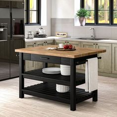 a kitchen island with plates and bowls on it