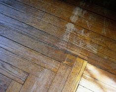 the wood floor is dirty and needs to be cleaned