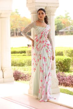 Georgette Pre-Drape Saree with Bias flare and pallu of floral Printed chiffon. Paired with heavily embroidered blouse with pearl details on hem Elegant Floral Print Floor-length Saree, Elegant Floor-length Floral Print Saree, Elegant Floral Print Pre-draped Saree For Reception, Elegant Floral Pre-draped Saree For Reception, Elegant Floral Print Georgette Sharara, Elegant Georgette Pre-draped Saree With Floral Print, Elegant Pre-draped Georgette Saree With Floral Print, Festive Pre-draped Saree With Floral Print For Reception, Festive Floral Print Pre-draped Saree For Reception