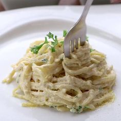 a fork is stuck into some food on a plate