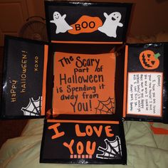 four halloween boxes are stacked on top of each other and decorated with black and orange lettering