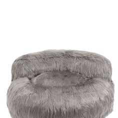 a grey round chair sitting on top of a white floor