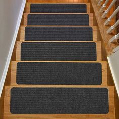 four carpeted steps leading up to the top of a stair case in a house