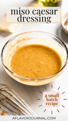 a glass bowl filled with sauce on top of a table