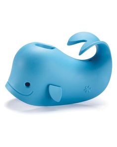 a blue whale toy sitting on top of a white surface