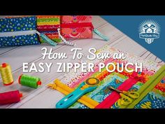 sewing supplies sitting on top of a table with the words how to sew an easy zipper pouch