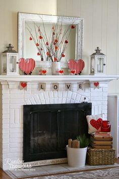 a mantel decorated with red and white hearts